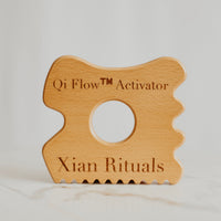 Qi Flow™ Activator on marble table background