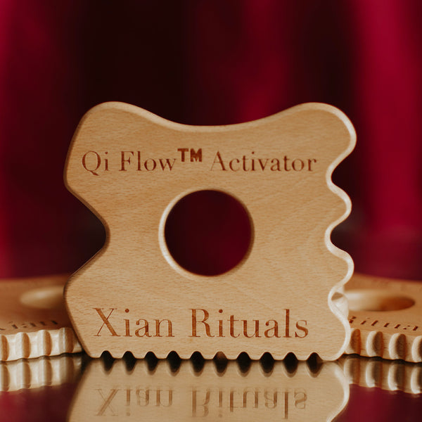 Qi Flow™ Activator wooden gua sha—one upright, two flat showcasing comb edge and tool thickness for TCM-inspired self-care
