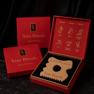 Qi Flow™ Activator wooden gua sha tool in red Xian Rituals packaging with three boxes, one open