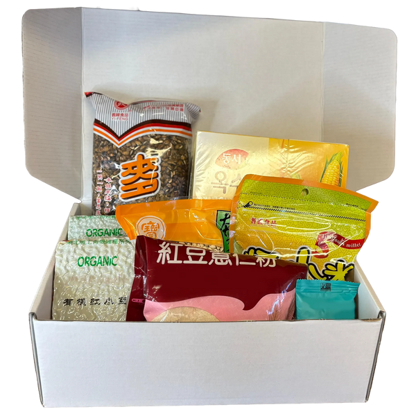 Top-down view of Qi Reset™ Ritual Kit with Chinese medicine–inspired meal contents displayed in white box