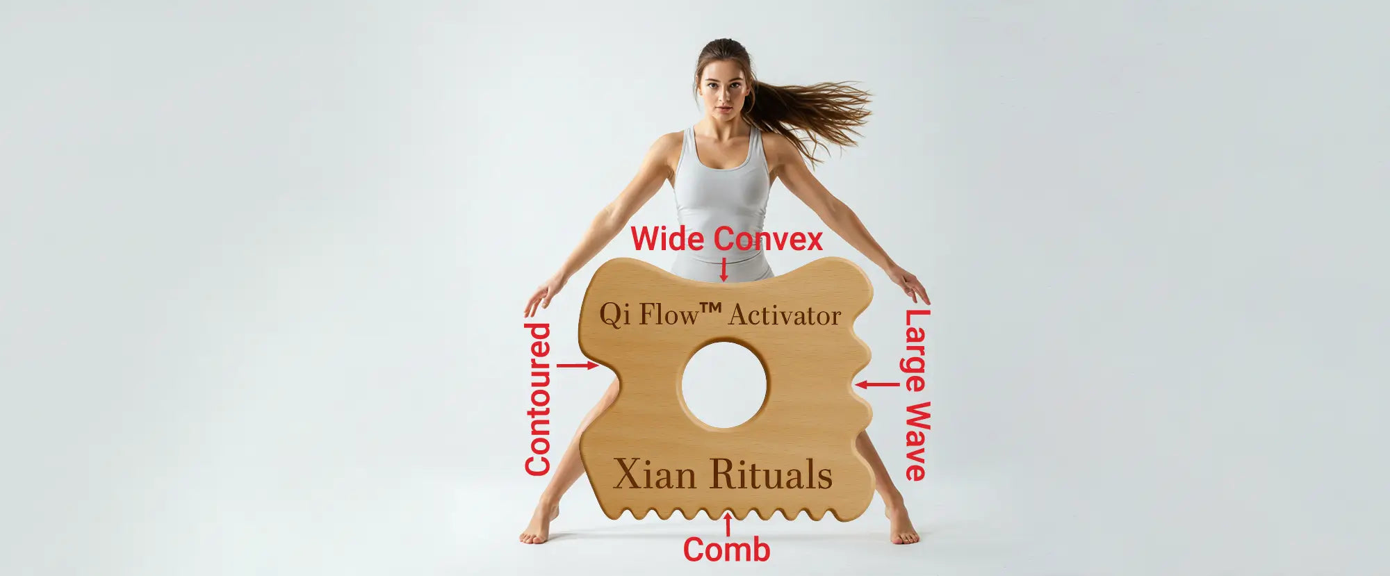 Girl posing behind a life-size Qi Flow™ Activator showcasing its four distinct edges—wide, wave, comb, and contoured—on homepage banner